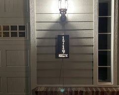 An illuminated Aluminum house sign that looks great during the day but truly shines at night with 46 LEDs and a dawn to dusk sensor - Black finish