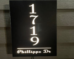 An illuminated Aluminum house sign that looks great during the day but truly shines at night with 46 LEDs and a dawn to dusk sensor - Black finish