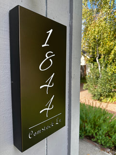 An illuminated Aluminum house sign that looks great during the day but truly shines at night with 46 LEDs and a dawn to dusk sensor - Dark Bronze finish