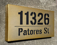 An illuminated Aluminum house sign that looks great during the day but truly shines at night with 46 LEDs and a dawn to dusk sensor - light Bronze finish